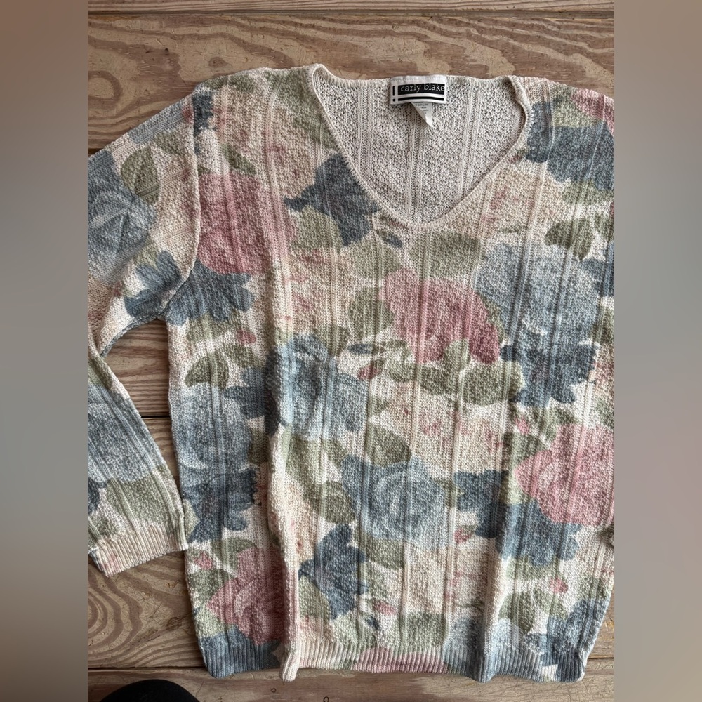 vintage-style knit sweater is branded by Carly Blake size m